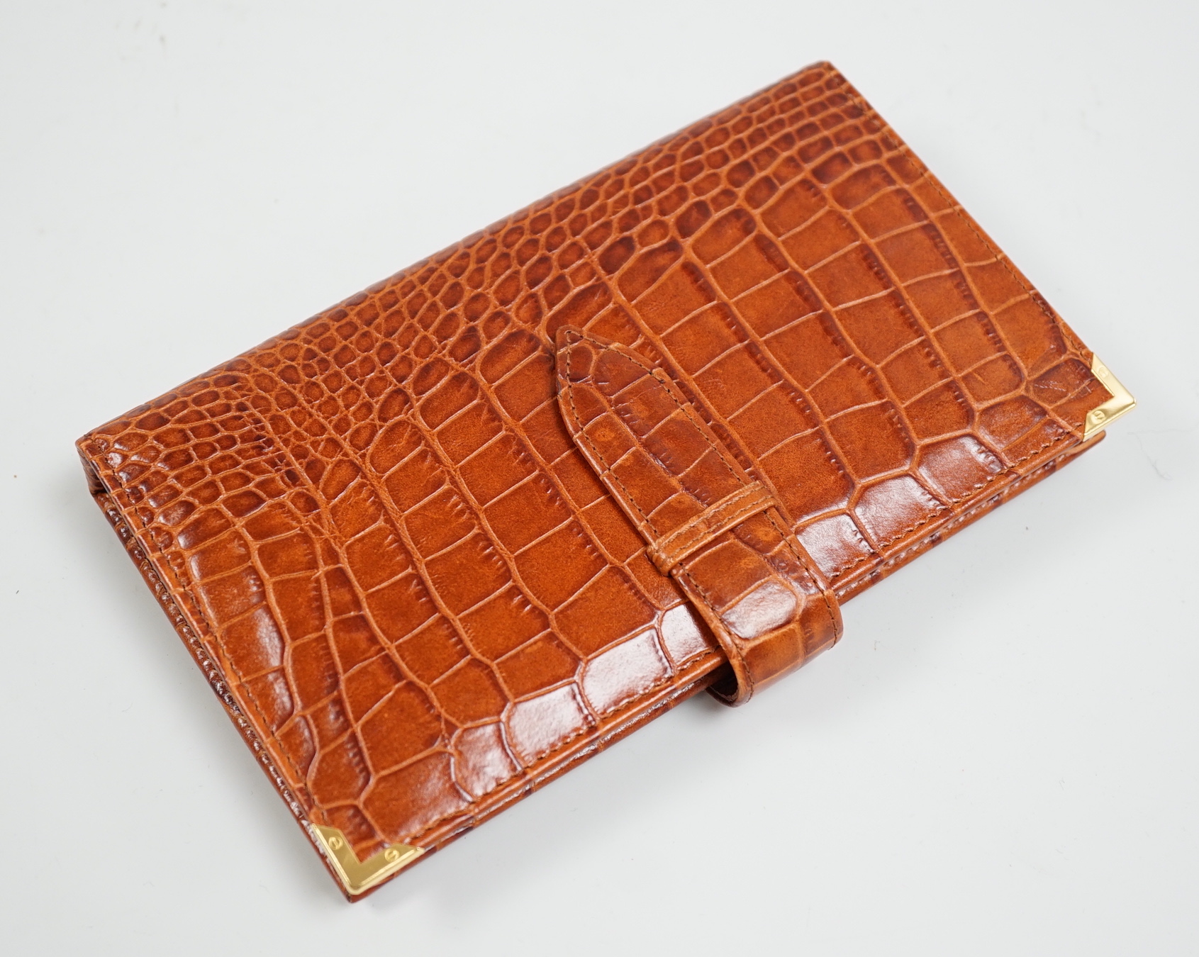 An Aspinal of London faux crocodile card book